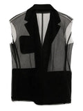 Black Comme Des Garçons sleeveless blazer